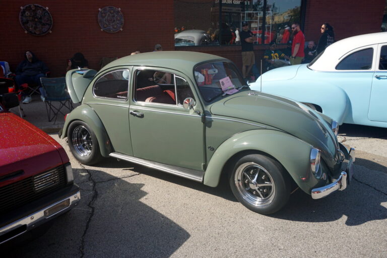 Classic Volkswagen Beetle at a car show, representative of the Florida Bug Jam