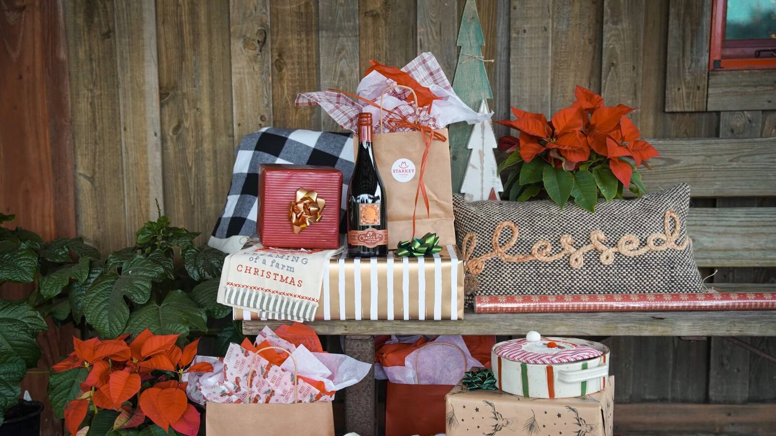 Wrapped gifts and holiday items displayed at a market near Starkey Park